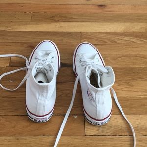 Women’s size 9 white Converse high tops.